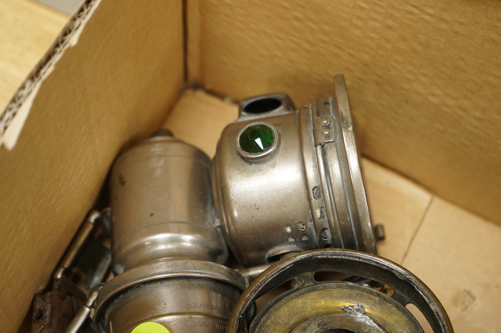 An early 20th century Lucas ‘King of the Road’ brass carriage lamp, 35cm high, together with five brass motorcycle lamps by Lucas, etc.